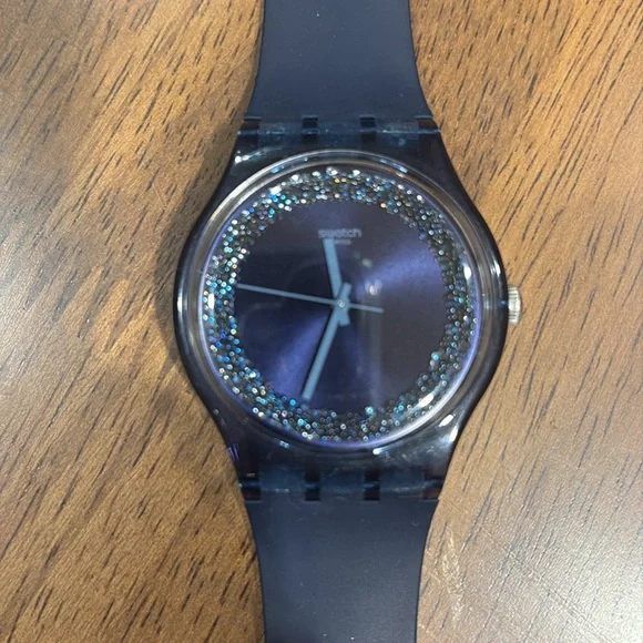 Navy Swatch Watch with navy circle sparkle on watch face. - Picture 4 of 4